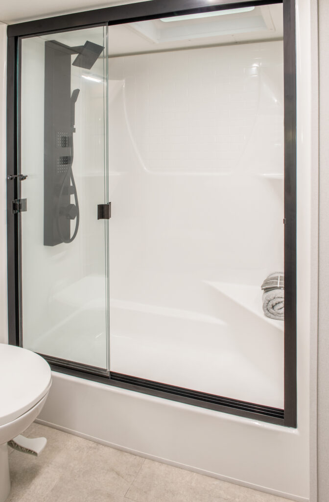 Interior of the 2025 Heartland RV Bighorn 391MFB Fifth Wheel bathroom featuring a spacious shower.