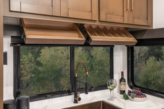 Interior of the 2025 Heartland RV Bighorn 391MFB Fifth Wheel kitchen showing spacious cabinet storage.