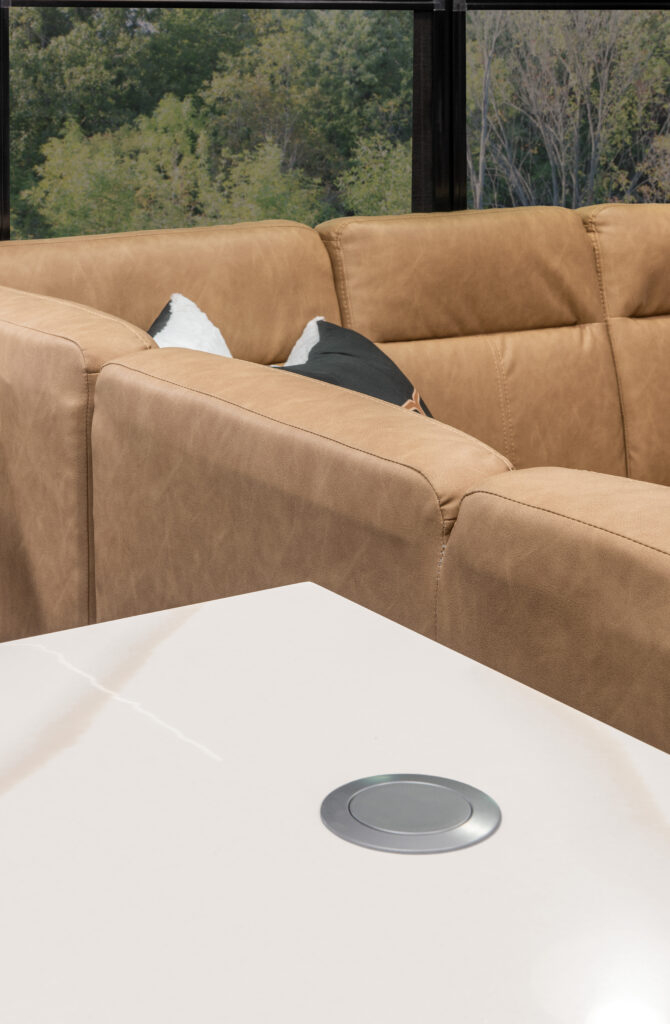 Interior of the 2025 Heartland RV Bighorn 391MFB Fifth Wheel, showing a kitchen countertop with an electrical outlet.