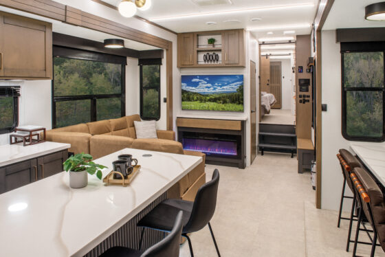 2025 Heartland Bighorn 391 MFB Fifth Wheel interior, showcasing the kitchen and living room area.