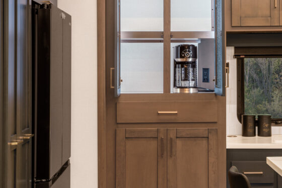 Interior of the 2025 Heartland RV Bighorn 391MFB Fifth Wheel showcasing a kitchen pantry storage area.
