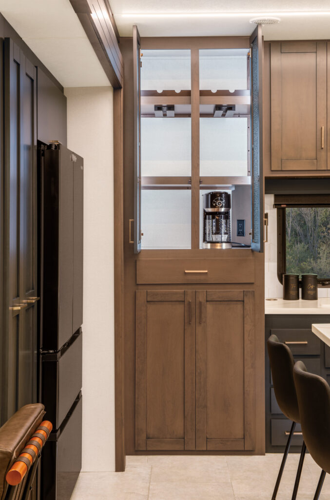Interior of the 2025 Heartland RV Bighorn 391MFB Fifth Wheel showcasing a kitchen pantry storage area.