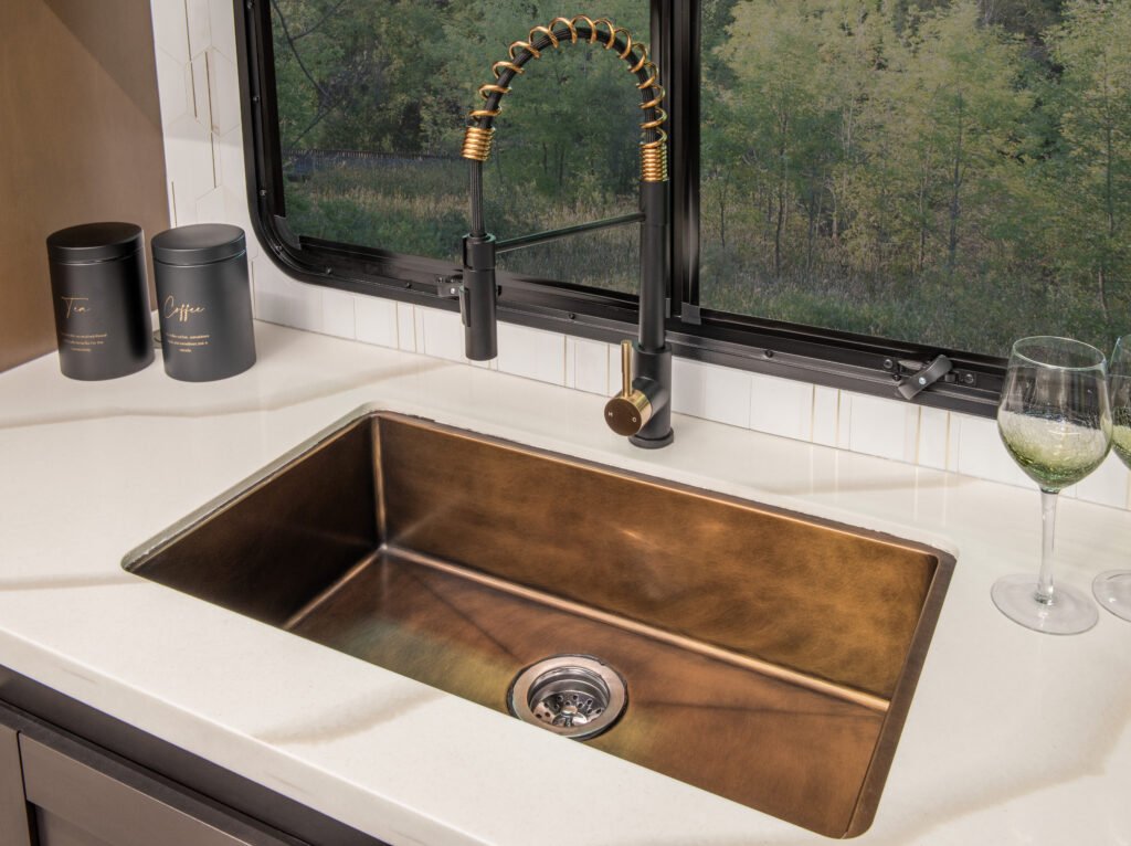Interior of the 2025 Heartland RV Bighorn 391MFB Fifth Wheel showing kitchen sink with modern faucet.