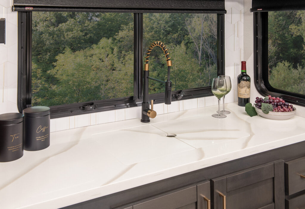 2025 Heartland RV Bighorn 391MFB Fifth Wheel kitchen featuring a closed kitchen sink cover.
