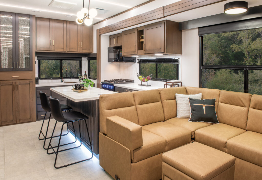 Interior of the 2025 Heartland RV Bighorn 391MFB Fifth Wheel, featuring the living room and kitchen with modern finishes.