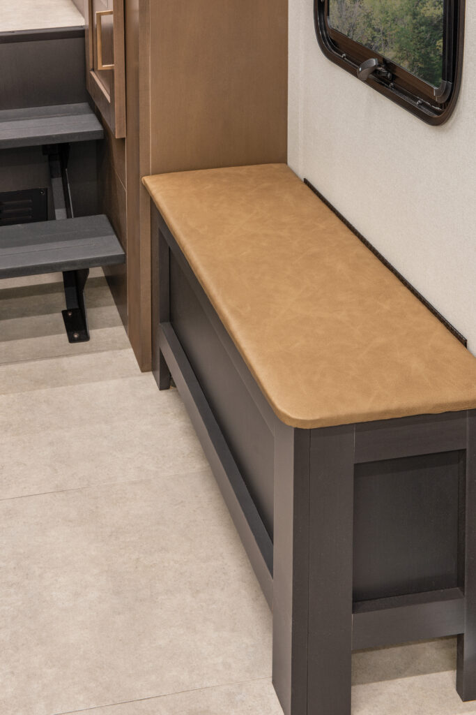 Closed pillow storage in the living room of the 2025 Heartland RV Bighorn 391MFB Fifth Wheel.