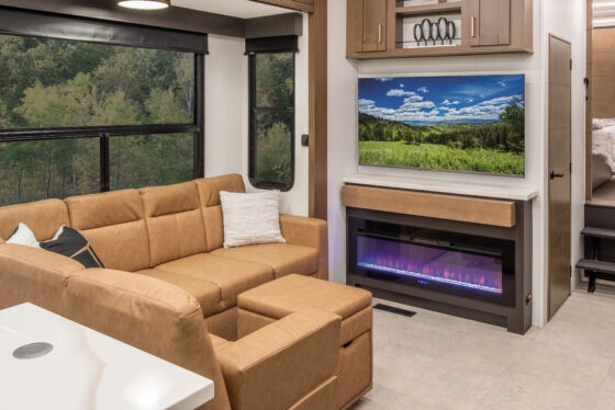 Interior of the 2025 Heartland RV Bighorn 391MFB Fifth Wheel, featuring a comfortable living room with a sofa.