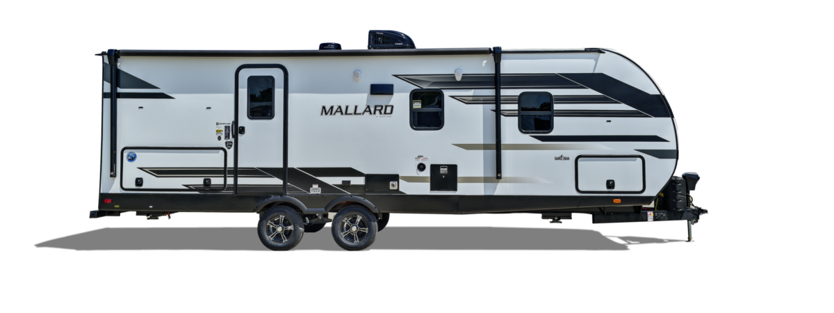 A preview of a stylish Heartland RV against a backdrop of blue sky and lush green trees.