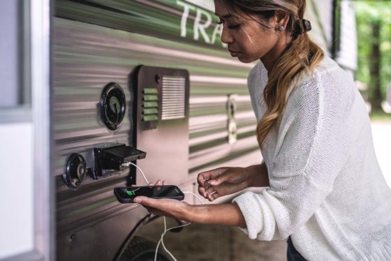 Outdoor speaker and accessory station on a Trail Runner travel trailer, enhancing outdoor entertainment and convenience.