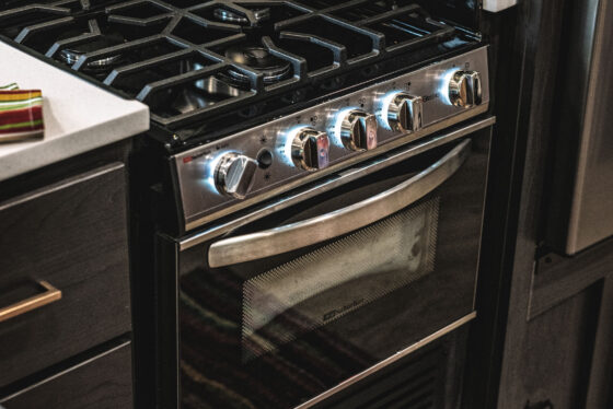A well-appointed kitchen inside a Heartland RV, featuring modern appliances and ample storage.