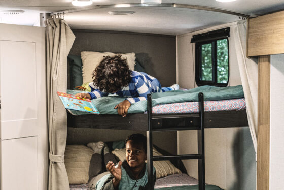 Interior view of a Heartland RV, showcasing the bedroom area and living space.
