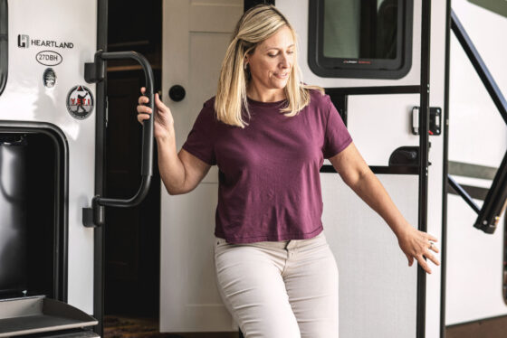 Exterior view of the door and stairs of a Heartland North Trail travel trailer.