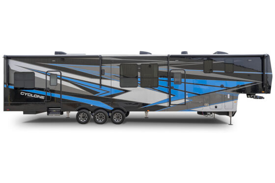 Side view of a 2024 Heartland Cyclone toy hauler with a custom exterior paint design, showcasing its sleek graphics and modern styling.