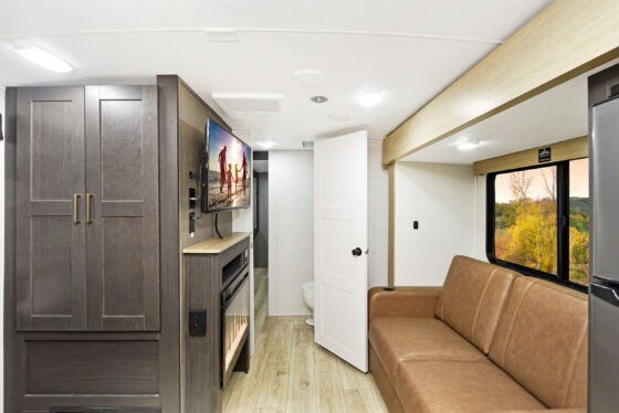 Interior view of a Heartland RV, showcasing the bedroom area and living space.