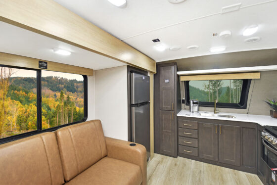 Interior view of a Heartland RV, showcasing the bedroom area and living space.