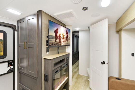 Interior view of a Heartland RV, showcasing the bedroom area and living space.