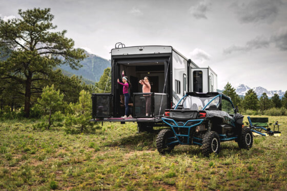 Back patio of the Heartland Torque RV with spacious outdoor living area and retractable awning.