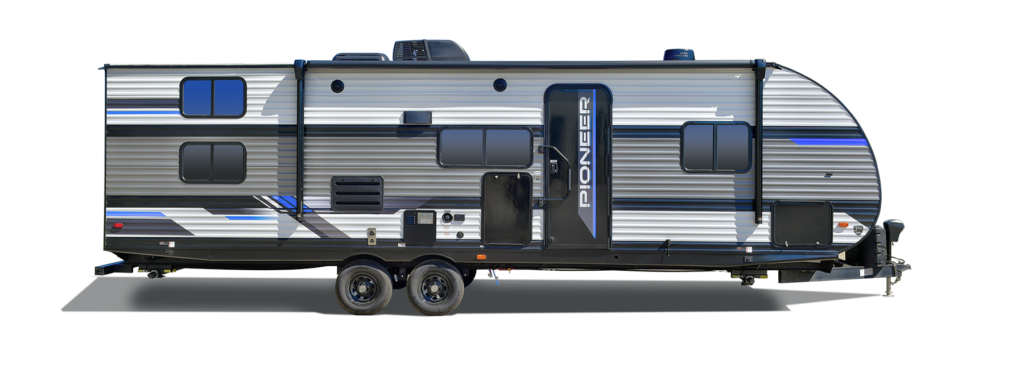 A lineup of modern Heartland Pioneer travel trailers parked in a row.