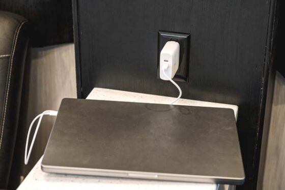 Close-up of an electrical outlet inside the 2025 Heartland Cyclone Fifth Wheel, showcasing its modern design and functionality.