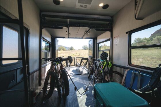Rear storage area of the 2025 Heartland Cyclone Fifth Wheel, designed for bikes and outdoor gear with ample space and secure features.