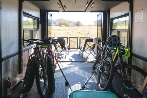 Rear storage area of the 2025 Heartland Cyclone Fifth Wheel, designed for bikes and outdoor gear with ample space and secure features.