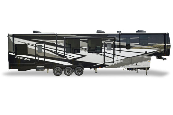 Exterior view of the 2021 Heartland Bighorn 3870FB, showcasing its sleek design with a large front cap and spacious storage compartments.
