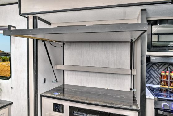 Interior view of hidden storage compartments in a Heartland RV.