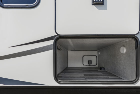 exterior view of a storage compartment on a north trail travel trailer showing lot's of space and depth for plenty of adventures