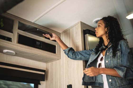 Above kitchen storage compartments in a Sundance Ultra Lite travel trailer, providing ample space for kitchen essentials.