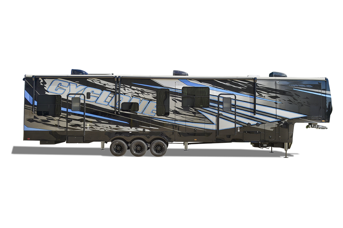Exterior side profile of a Heartland Cyclone toy hauler, featuring bold graphics, multiple slide-outs, and a spacious garage.