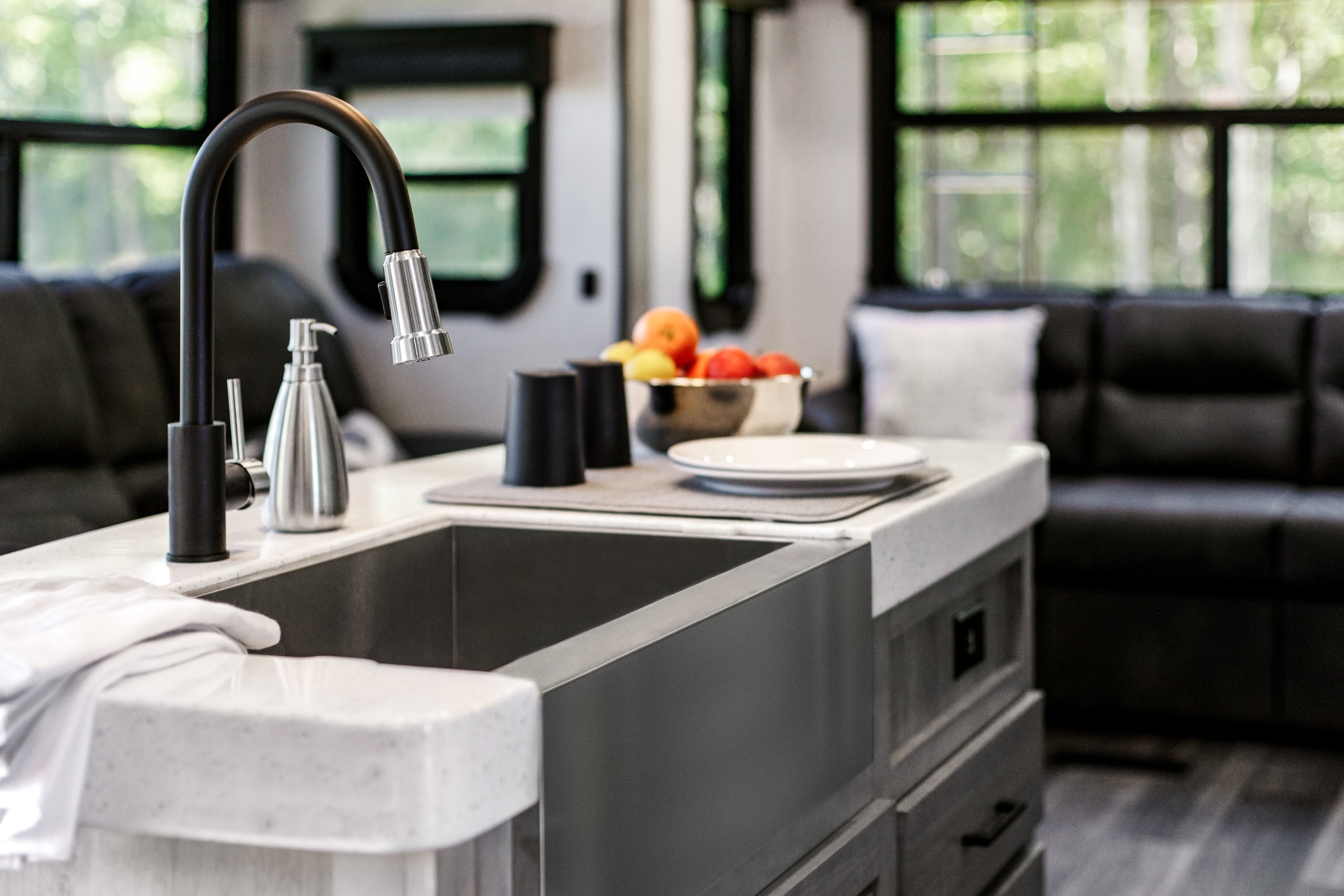 A close-up shot of a matte black sink faucet in the Big Country RV.