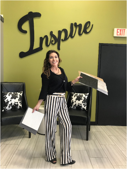 A photo of a stylish woman, Renee Gillis, in the Heartland Design Center.