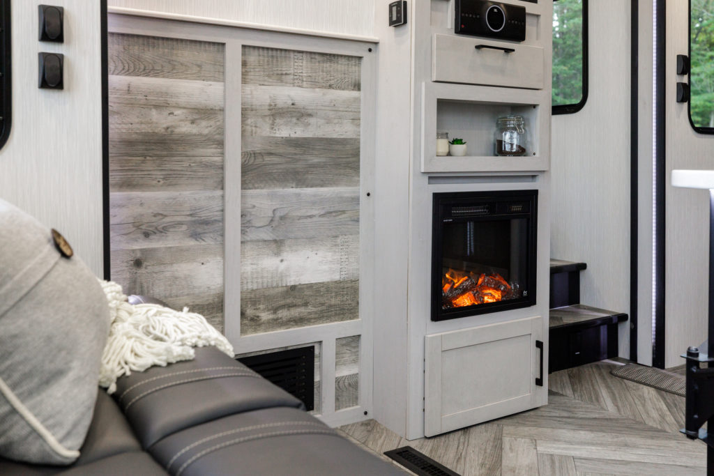 A glowing fire inside a Heartland RV.