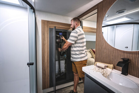 Interior view of the bathroom in the 2024 Heartland Corterra fifth-wheel RV, showcasing a modern shower, vanity, and sleek design elements