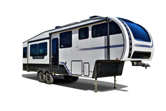 Front and side view of the Heartland Corterra fifth-wheel RV with slides in, showcasing its sleek exterior and aerodynamic design.