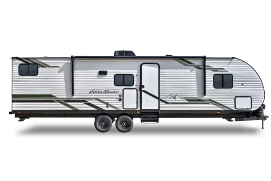 A white travel trailer with green and black stripes, two wheels on each side, a door near the front, windows, and a black awning, shown in profile against a black background.