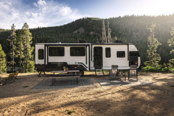 Exterior of the 2024 Heartland Cyclone 4008 Fifth Wheel Toy Hauler, showcasing its sleek design with multiple slide-outs and large windows.