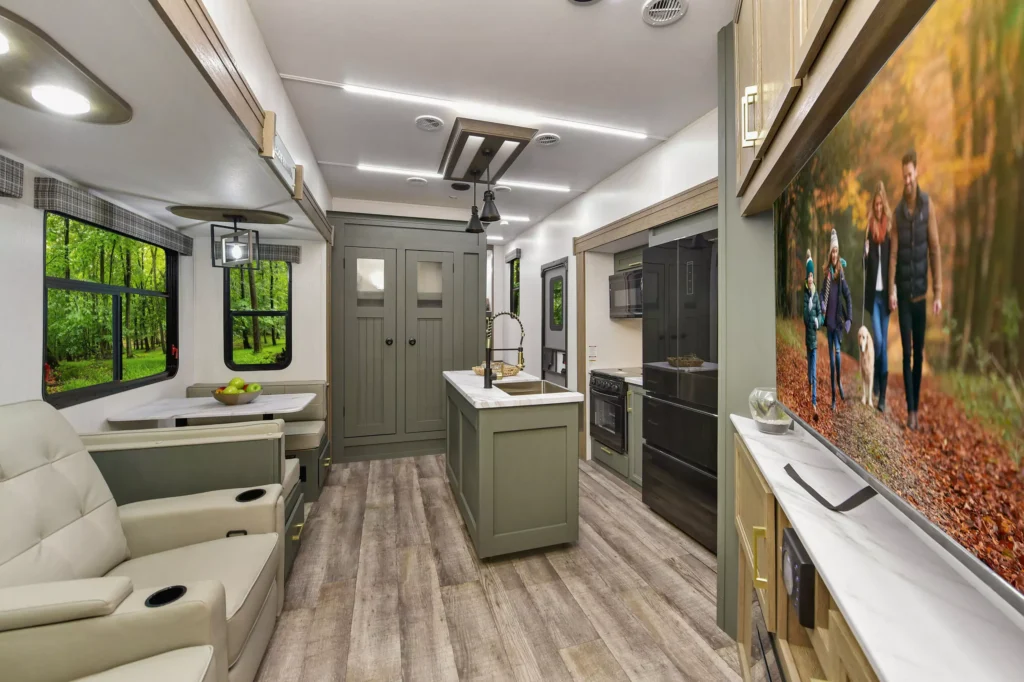 Spacious interior of the 2025 Heartland Eddie Bauer 3600LF Fifth Wheel, featuring modern furnishings, a fully equipped kitchen, and a comfortable living area.