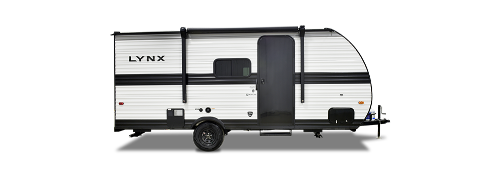 The image showcases a Heartland RV with a modern, sleek exterior designed for both style and durability. The RV features an aerodynamic front cap, bold graphic accents, and large tinted windows that provide a great view while maintaining privacy. A power awning extends from the side, offering an excellent outdoor living space. The sturdy entry steps make access easy, while the dual-axle setup ensures smooth towing. At the front, a power tongue jack and propane tanks add convenience for quick setup. The design focuses on blending functionality with aesthetics, making this RV a perfect companion for adventurous road trips.